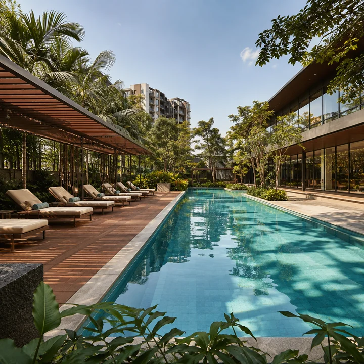 Embassy Sadahalli indicative lap pool with a timber sun deck and slatted pergola beside the glazed clubhouse wing Embassy Sadahalli indicative lap pool with a timber sun deck and slatted pergola beside the glazed clubhouse wing